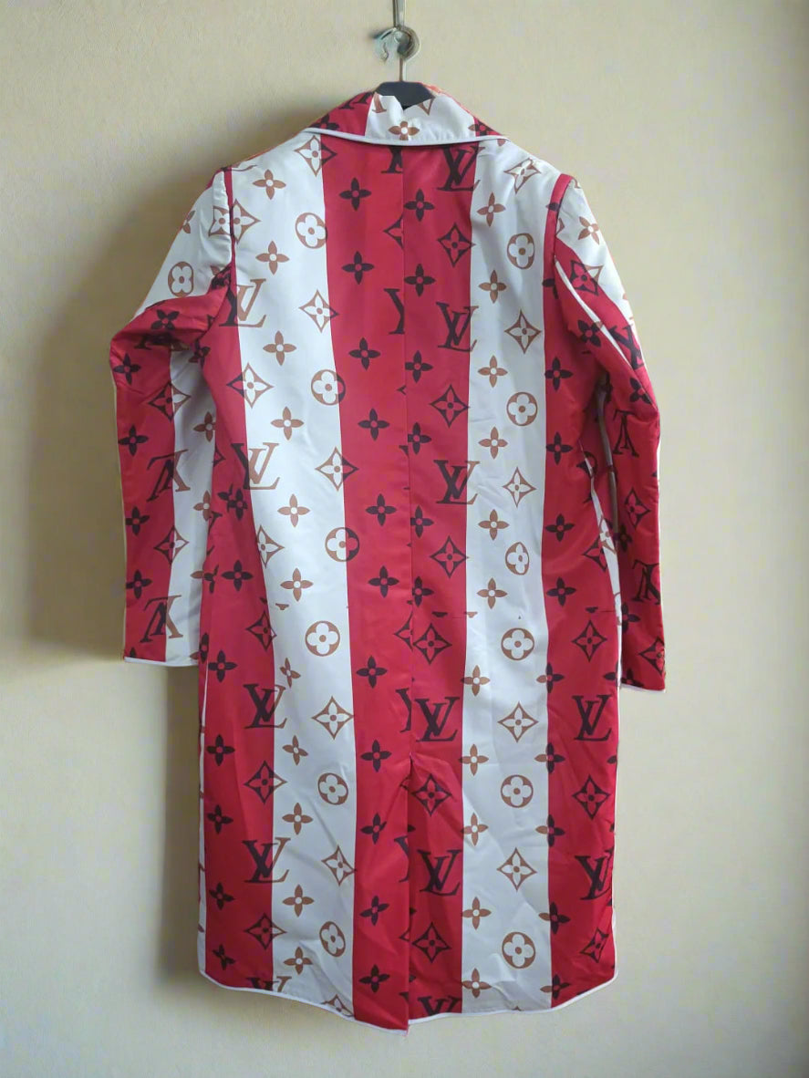 red n white stripedd designer long coat hang on a wall hanger against an ivory wall